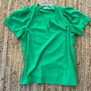 Staccato size small Kelly green top with flutter sleeves.